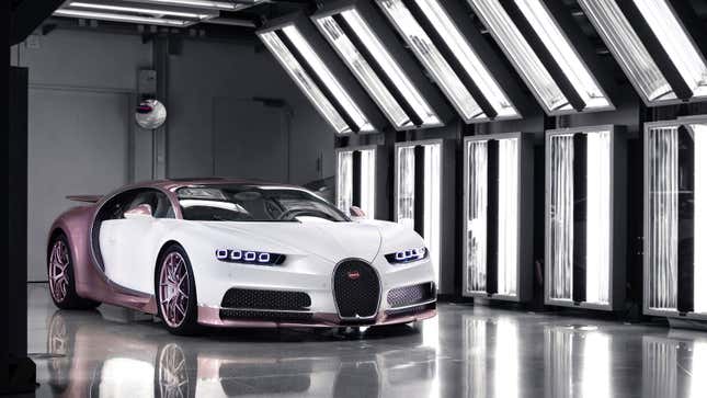 A photo of a pink and white Bugatti Chiron. 