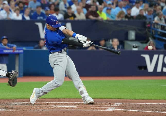 Aug 11, 2023; Toronto, Ontario, CAN; Chicago Cubs right fielder Seiya Suzuki (27) hits a two RBI double against the Toronto Blue Jays during the fourth inning at Rogers Centre.