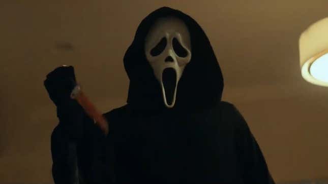 Ghostface raises a bloodied knife to the camera in a scene from the new Scream.