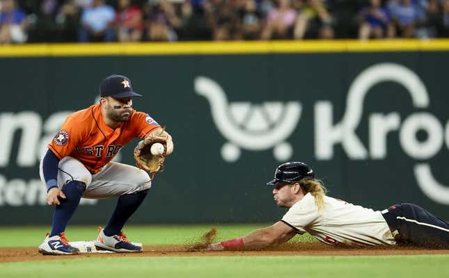 Jul 1, 2023; Arlington, Texas, USA;  Texas Rangers left fielder Travis Jankowski (16) steals second base ahead of the tag by Houston Astros second baseman Jose Altuve (27) during the fourth inning at Globe Life Field.