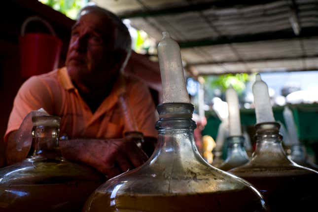 Estevez’s product is bottled and sold for consumption in homes and restaurants, with sales at an average of 50 bottles a day for 10 Cuban pesos (40 cents) apiece. (AP Photo/Ramon Espinosa)