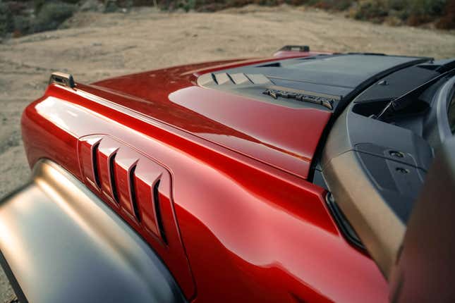 The front fender of a red 2022 Ford Bronco Raptor