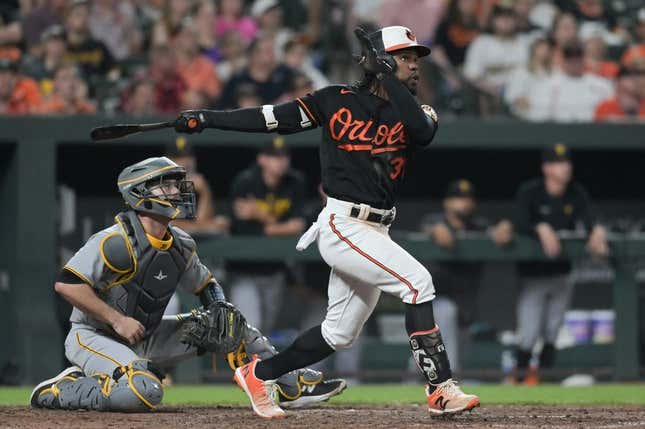 May 12, 2023; Baltimore, Maryland, USA; Baltimore Orioles center fielder Cedric Mullins (31) hits swings through a eighth inning three run homerun against the Pittsburgh Pirates  at Oriole Park at Camden Yards.