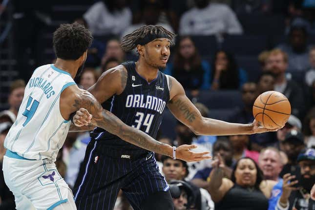 Mar 3, 2023; Charlotte, North Carolina, USA; Orlando Magic center Wendell Carter Jr. (34) looks to pass against Charlotte Hornets center Nick Richards (4) during the second half at Spectrum Center.