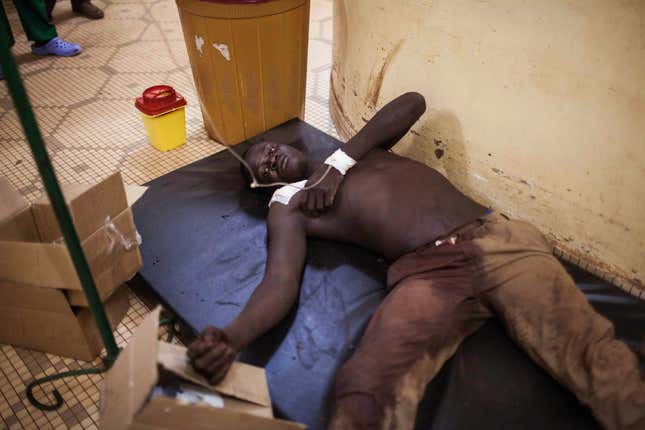 A Burkina Faso protestor who was injured during clashes receives treatment in hospital in Ouagadougou.