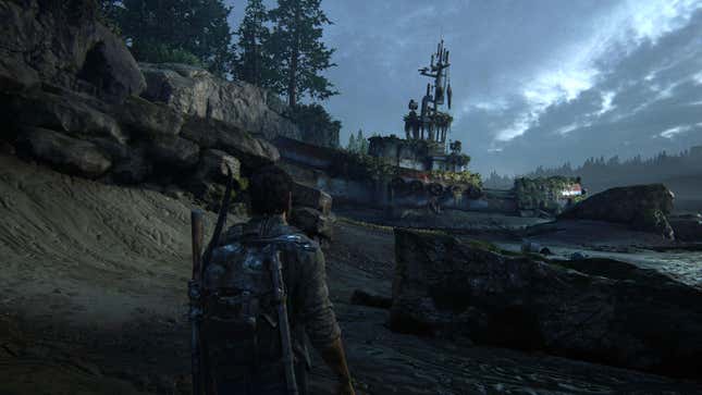 An old boat rests on a beach in the game The Last of Us.