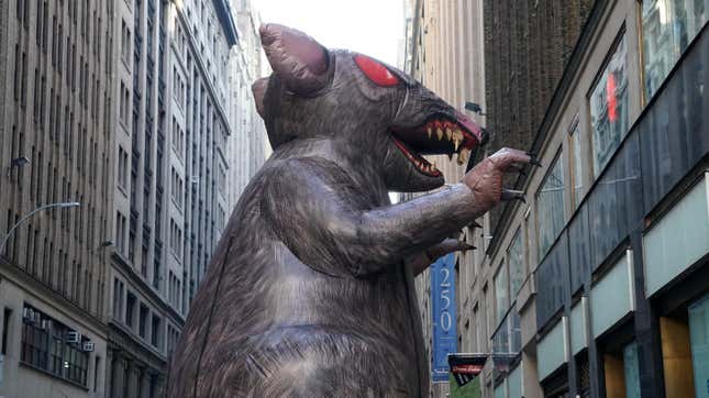 A giant inflatable rat makes its way down the street in midtown New York City on November 26, 2019, where it will sit outside a company’s office. American unions have used ballooned rodents to highlight unfair labor practices since the 1990s.
