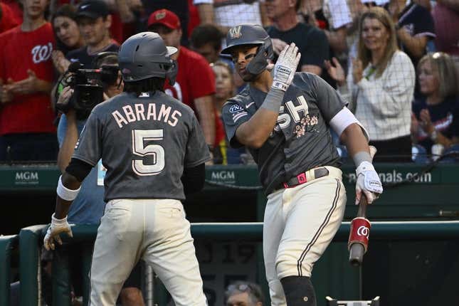 Sep 1, 2023; Washington, District of Columbia, USA; Washington Nationals shortstop CJ Abrams (5) is congratulated by designated hitter Joey Meneses (45) after hitting a solo home run against the Miami Marlins during the first inning at Nationals Park.