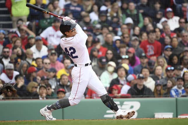 Apr 15, 2023; Boston, Massachusetts, USA; Boston Red Sox short stop Yu Chang (20) hits a two run home run during the fourth inning against the Los Angeles Angels at Fenway Park.