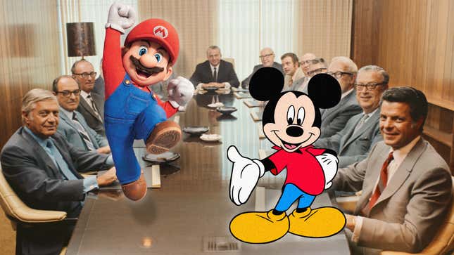 An image shows a board room full of people look on as Mickey Mouse points at Mario while the two of them stand on a table. 