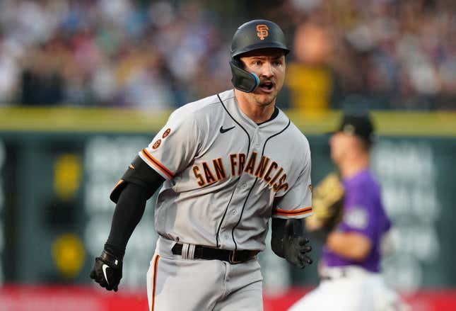 Jun 6, 2023; Denver, Colorado, USA; San Francisco Giants catcher Patrick Bailey (14) runs out a RBI triple in the third inning against the Colorado Rockies at Coors Field.