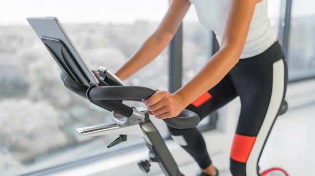 Woman riding an indoor exercise bike