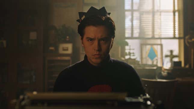 An incredibly irritated Jughead, wearing his whoopee cap, stars directly into the camera.