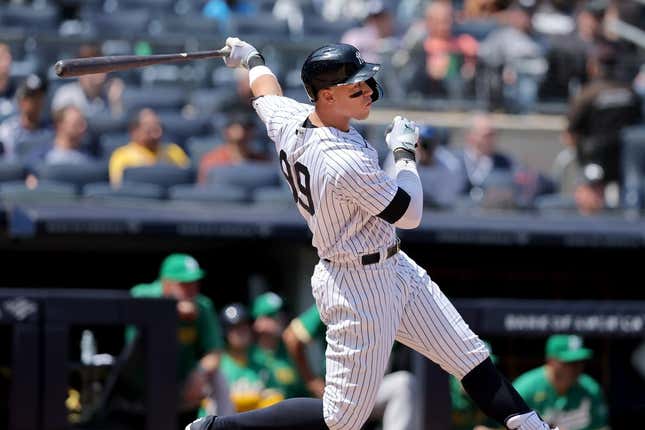 May 10, 2023; Bronx, New York, USA; New York Yankees designated hitter Aaron Judge (99) follows through on a double against the Oakland Athletics during the fifth inning at Yankee Stadium.