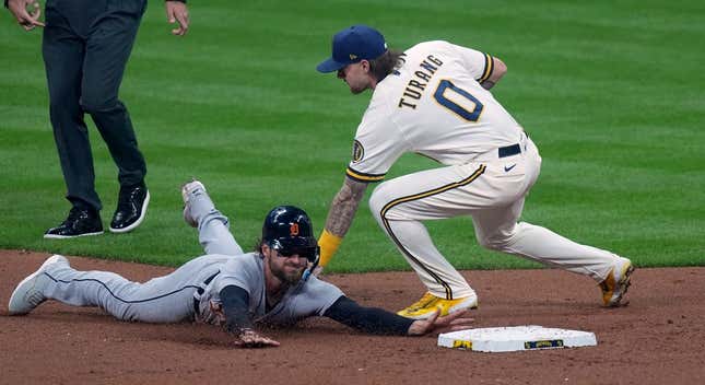 Apr 24, 2023; Milwaukee, Wisconsin, USA; Milwaukee Brewers second baseman Brice Turang (0) tags Detroit Tigers catcher Eric Haase (13) while trying to steal second base during the third inning at American Family Field.