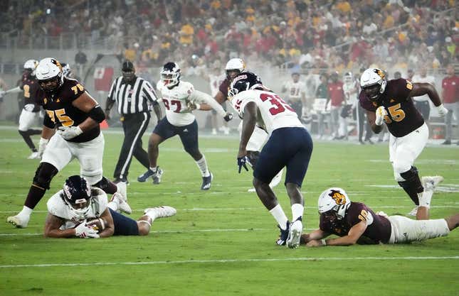 Fresno State Bulldogs defensive lineman Jacob Holmes (23) recovers a fumble by Arizona State Sun Devils quarterback Drew Pyne (10) in the first half at Mountain America Stadium in Tempe on Sept. 16, 2023.