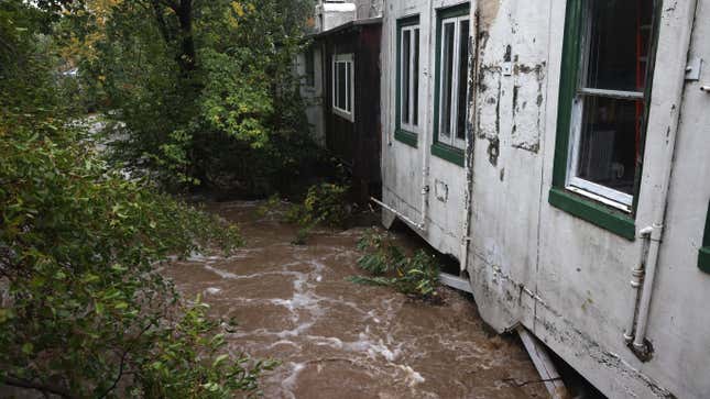 The swollen San Anselmo creek touches the bottom of businesses on October 24, 2021 in San Anselmo, California.
