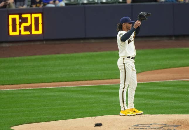 With the pitch timer in the distance, Milwaukee Brewers starting pitcher Freddy Peralta (51) stands on the mound during the first inning of their game against the New York Mets Monday, April 3, 2023 at American Family Field in Milwaukee, Wis. Brewers03 5