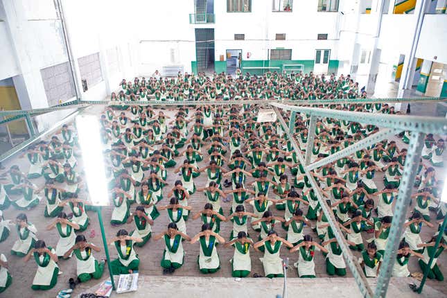 Students during yoga instruction at their morning assembly at Pardada Pardadi school.