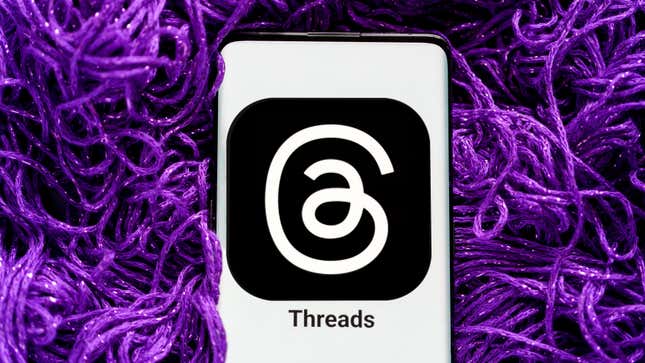 A smartphone displaying the Threads logo