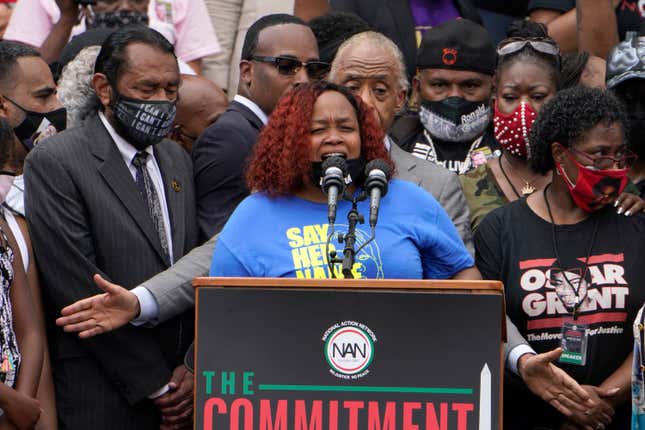 Tamika Palmer, mother of Breonna Taylor, speaks at the March on Washington, Friday Aug. 28, 2020, at the Lincoln Memorial in Washington. At left is Rep. Al Green, D-Texas, and at right is Rev. Al Sharpton.