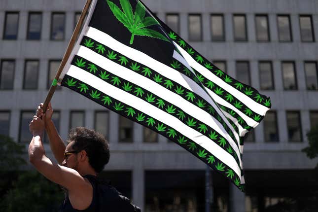American flag with marijuana symbols.