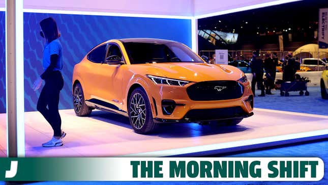 A yellow Ford Mustang Mach-E sits on display at the 2022 Chicago Auto Show.