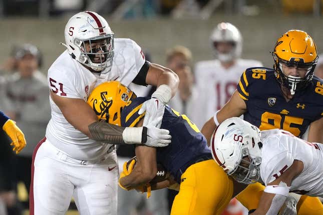 Nov 19, 2022; Berkeley, California, USA; Stanford Cardinal defensive lineman Jaxson Moi (51) tackles California Golden Bears running back Jaydn Ott (6) during the fourth quarter at FTX Field at California Memorial Stadium.
