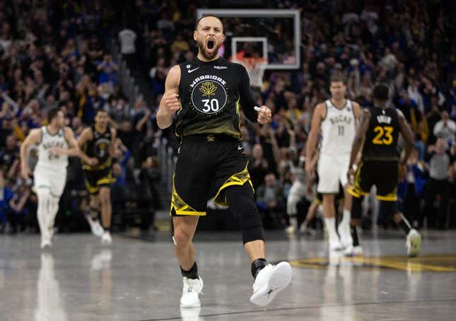 Mar 11, 2023; San Francisco, California, USA; Golden State Warriors guard Stephen Curry (30) reacts after making a three point basket to tie the score against the Milwaukee Bucks during the fourth quarter at Chase Center.