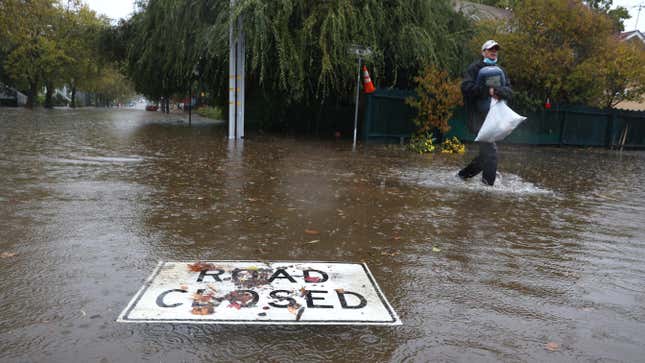 A road closed sign floats on a flooded street on October 24, 2021 in San Rafael, California.