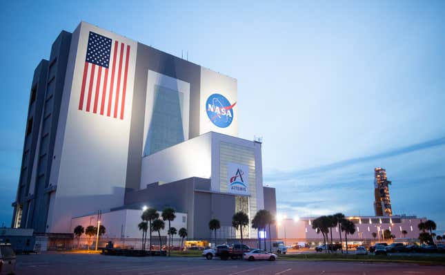 The SLS rocket (far right) arriving at the Vehicle Assembly Building on the morning of Tuesday, September 27.