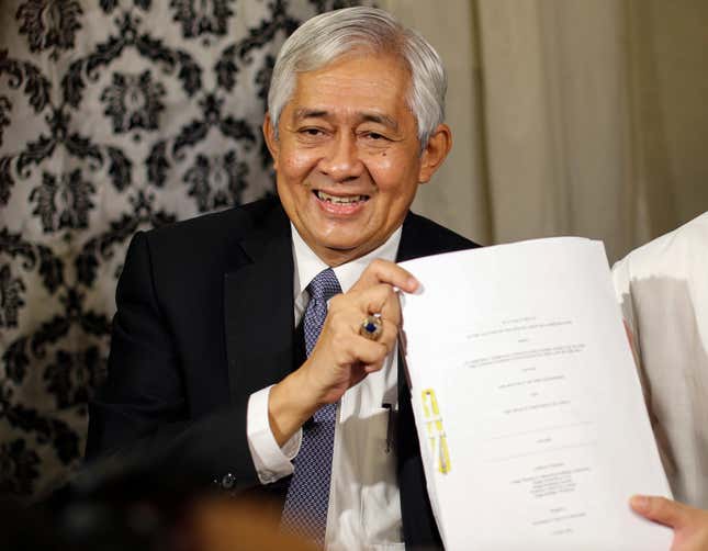 Francis Jardeleza, associate justice of the Supreme Court of the Philippines, shows a copy of the tribunal’s decision.