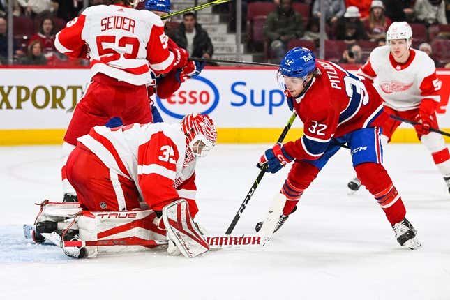 Apr 4, 2023; Montreal, Quebec, CAN; Detroit Red Wings goalie Ville Husso (35) makes a save against Montreal Canadiens center Rem Pitlick (32) during the second period at Bell Centre.