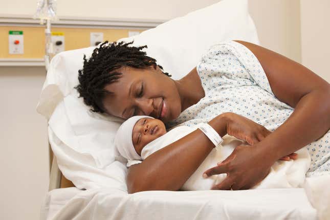 Black mother holding her baby