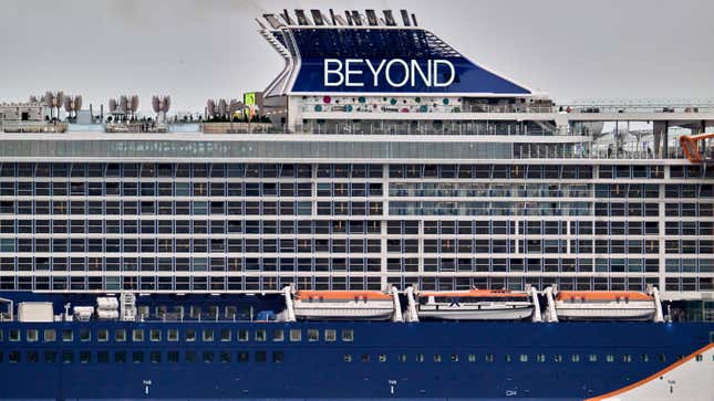 Large, multi-deck cruise ship with a dark blue bow and the words "Beyond" printed on top.