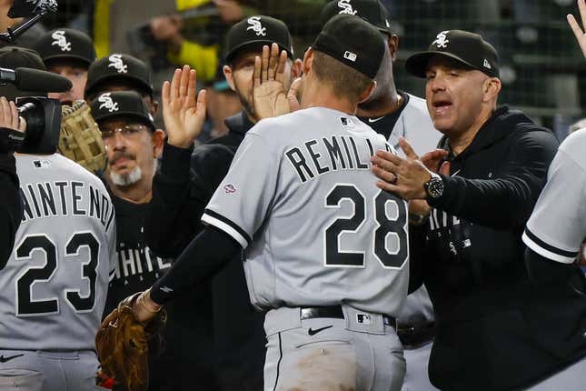 Jun 17, 2023; Seattle, Washington, USA; Chicago White Sox second baseman Zach Remillard (28) high fives manager Pedro Grifol, right, following a 4-3 victory against the Seattle Mariners in eleven innings at T-Mobile Park.