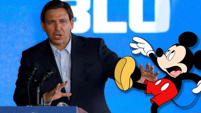 A photo shows DeSantis pushing a cartoon drawing of Mickey Mouse. 