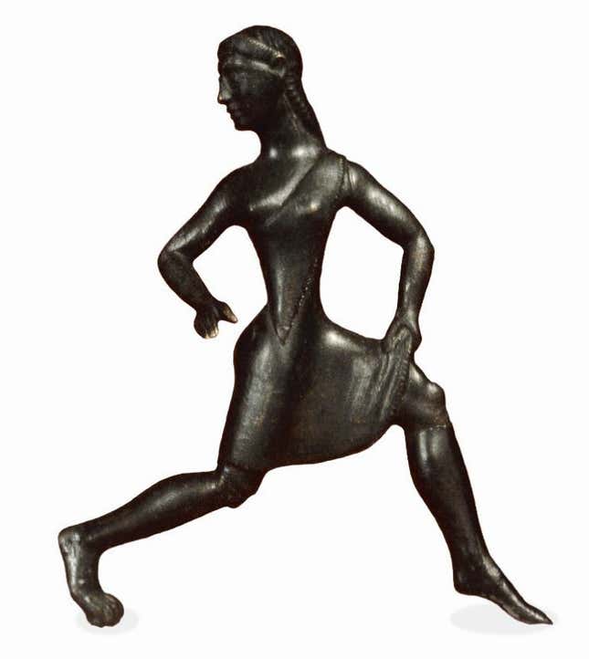Greek bronze figure of a running girl, which dates to about 500 BC, is dressed in the way that Pausanias describes girls competing at the Games of Hera. (The British Museum)