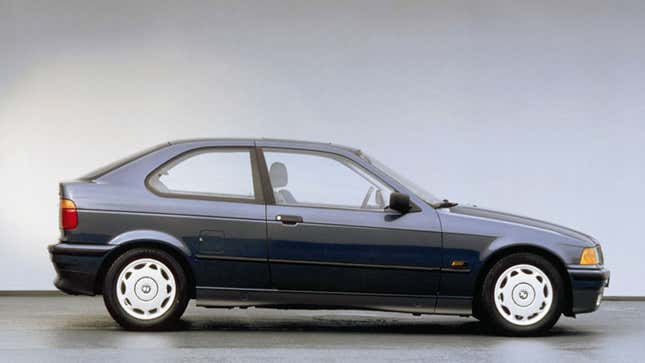 A photo of a blue BMW E36 car in profile. 