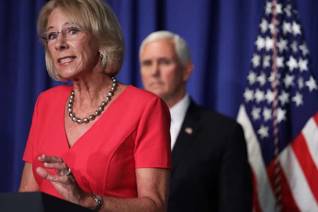 U.S. Secretary of Education Betsy DeVos speaks as Vice President Mike Pence listens during a White House Coronavirus Task Force press briefing at the U.S. Department of Education on July 8, 2020, in Washington, DC.