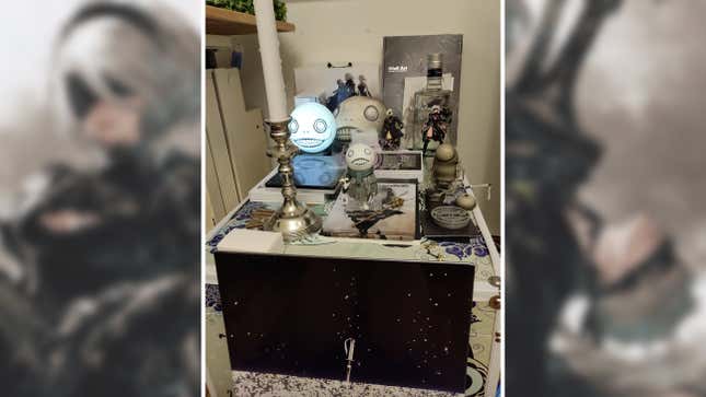 A Nier shrine appears full of Emil's face, along with other accessories.