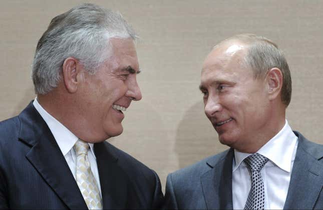 Russian Prime Minister Vladimir Putin, right, and Rex Tillerson, ExxonMobil's chief executive smile during a signing ceremony in the Black Sea resort of Sochi, Russia, Tuesday, Aug. 30, 2011. Russia's state-owned Rosneft teamed up with U.S. company ExxonMobil on Tuesday to develop huge offshore oil fields in the Russian Arctic in return for access to resources in the Gulf of Mexico.