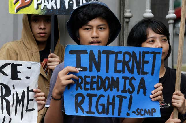 Demonstrators protest against a temporarily suspended cybercrime law.