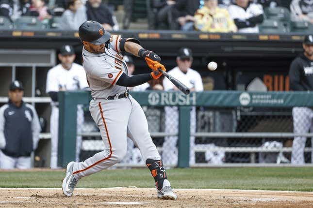 Apr 3, 2023; Chicago, Illinois, USA; San Francisco Giants third baseman David Villar (32) hits a solo home run against the Chicago White Sox during the fifth inning at Guaranteed Rate Field.