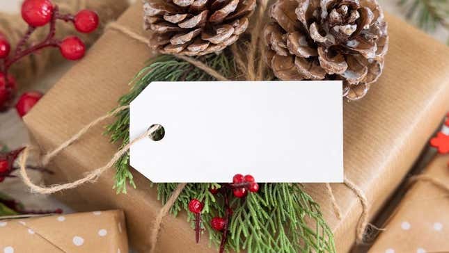 A white tag on a Christmas gift