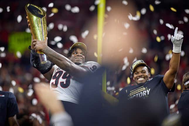 Georgia Bulldogs PK Jared Zirkel (99) holds up and celebrates with the National Championship Trophy after the Alabama Crimson Tide versus the Georgia Bulldogs in the College Football Playoff National Championship, on January 10, 2022, at Lucas Oil Stadium in Indianapolis, IN. 