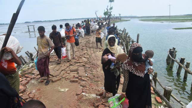 Hundreds of Rohingya people crossing Bangladesh’s border as they flee from Buchidong at Myanmar after crossing the Nuf River Shah Porir Dwip Island near Teknaf in Cox’s Bazar, Bangladesh, on September 07, 2017.