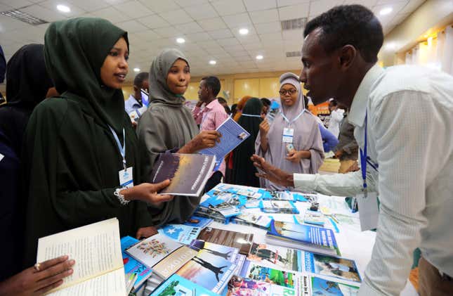People browse through books during the third annual book fair in Mogadishu, Somalia in 2017.