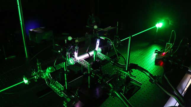 A bright green laser shoots through an experimental set-up in France.