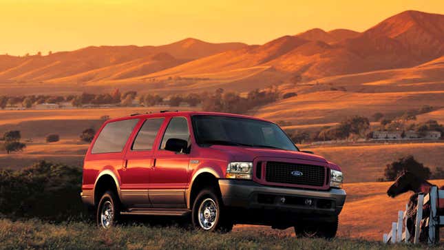 A photo of a red Ford Excursion SUV. 